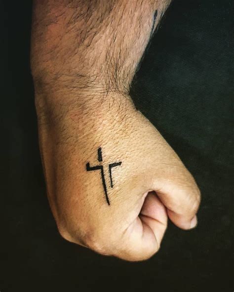 hand cross tattoo|small cross tattoo on hand.